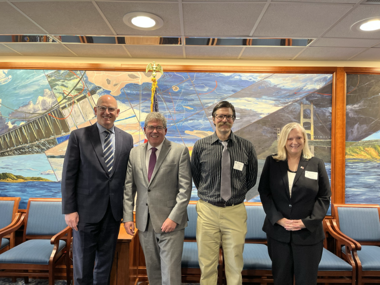 Panelists posing for a photo. Left to right: Mayor Dilkins, Colin Bird, Jason Miller, Rebecca Malouin.