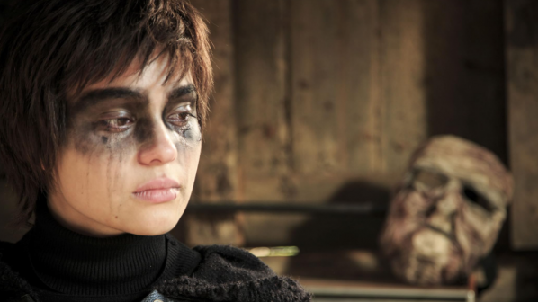 Still frame from Rhymes for Young Ghuls (2013, showing the protagonist with black eye makeup. 