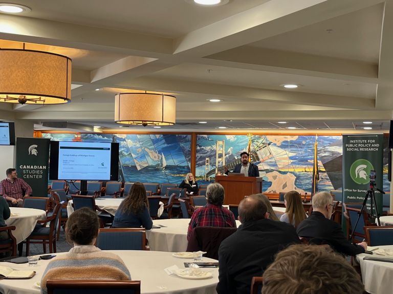 Dr Ortega presenting his research to attendees.